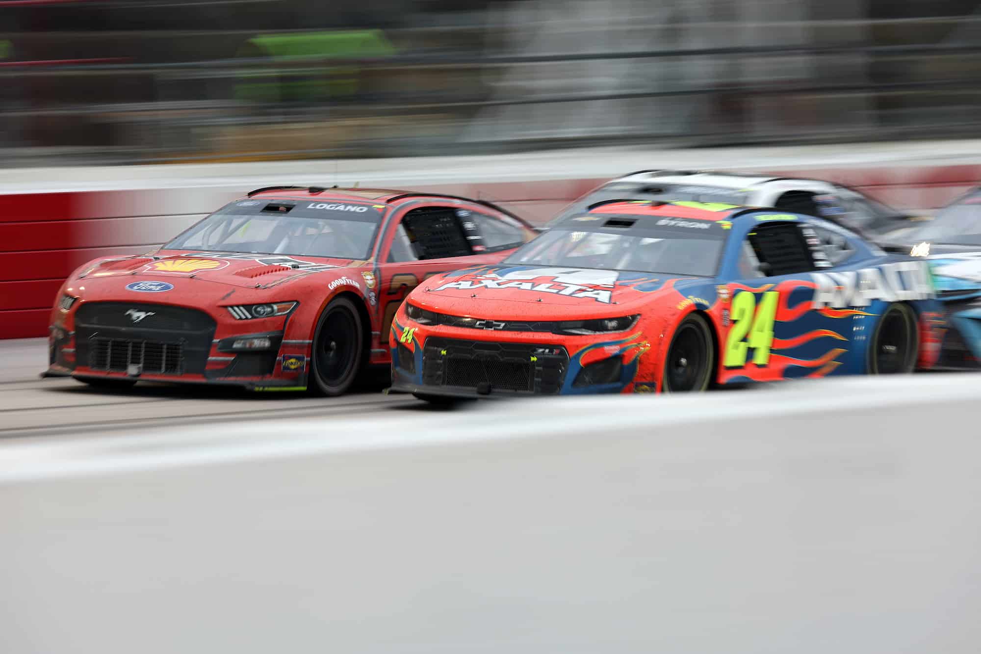 Joey Logano and William Byron race