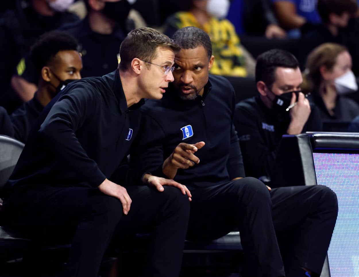 Jon Scheyer (L) and Chris Carrawell (R) during a Duke Blue Devils game.