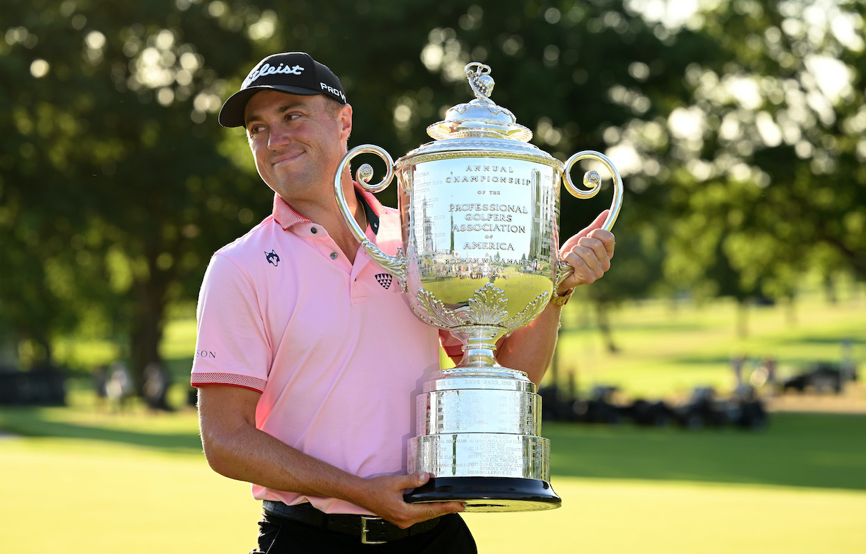 Justin Thomas poses with the Wanamaker Trophy.