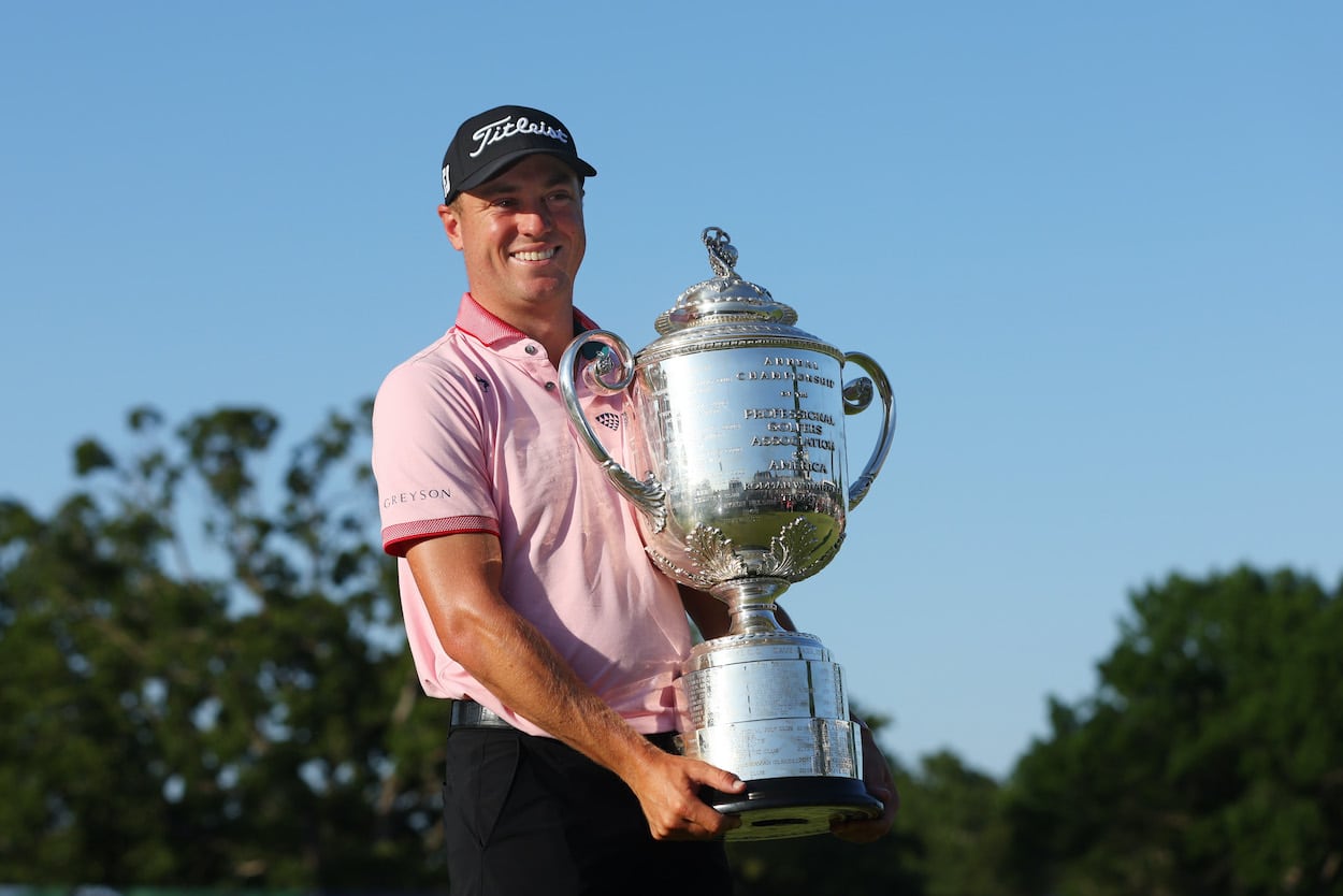 Justin Thomas poses with the Wanamaker Trophy.