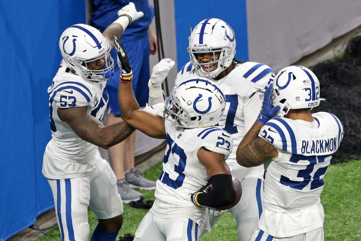Indianapolis Colts cornerback Kenny Moore II celebrating with teammates in 2020.
