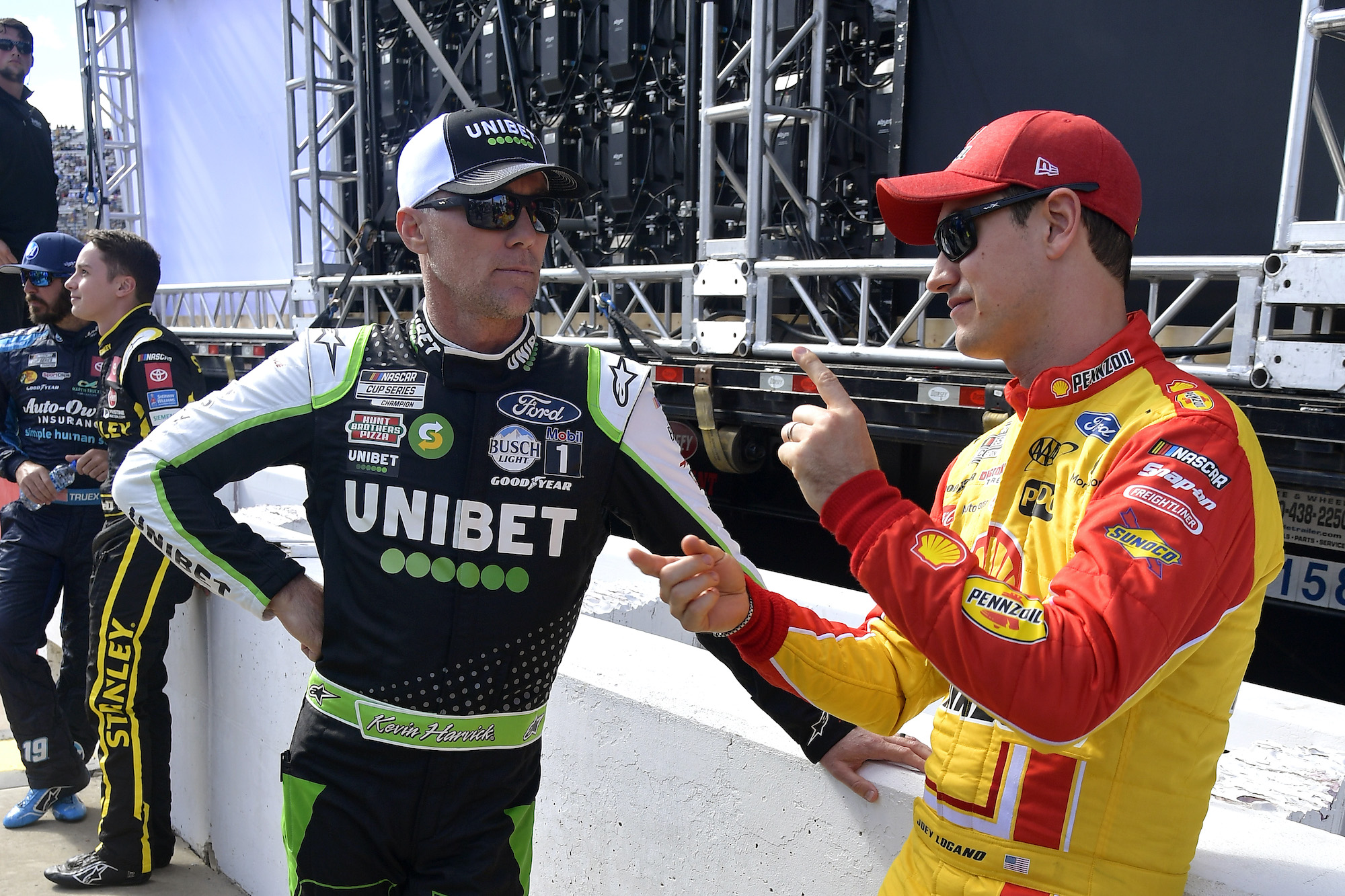 Kevin Harvick and Joey Logano talk backstage of prerace ceremonies prior to the NASCAR Cup Series Xfinity 500 at Martinsville Speedway on October 31, 2021. | Photo by Logan Riely/Getty Images
