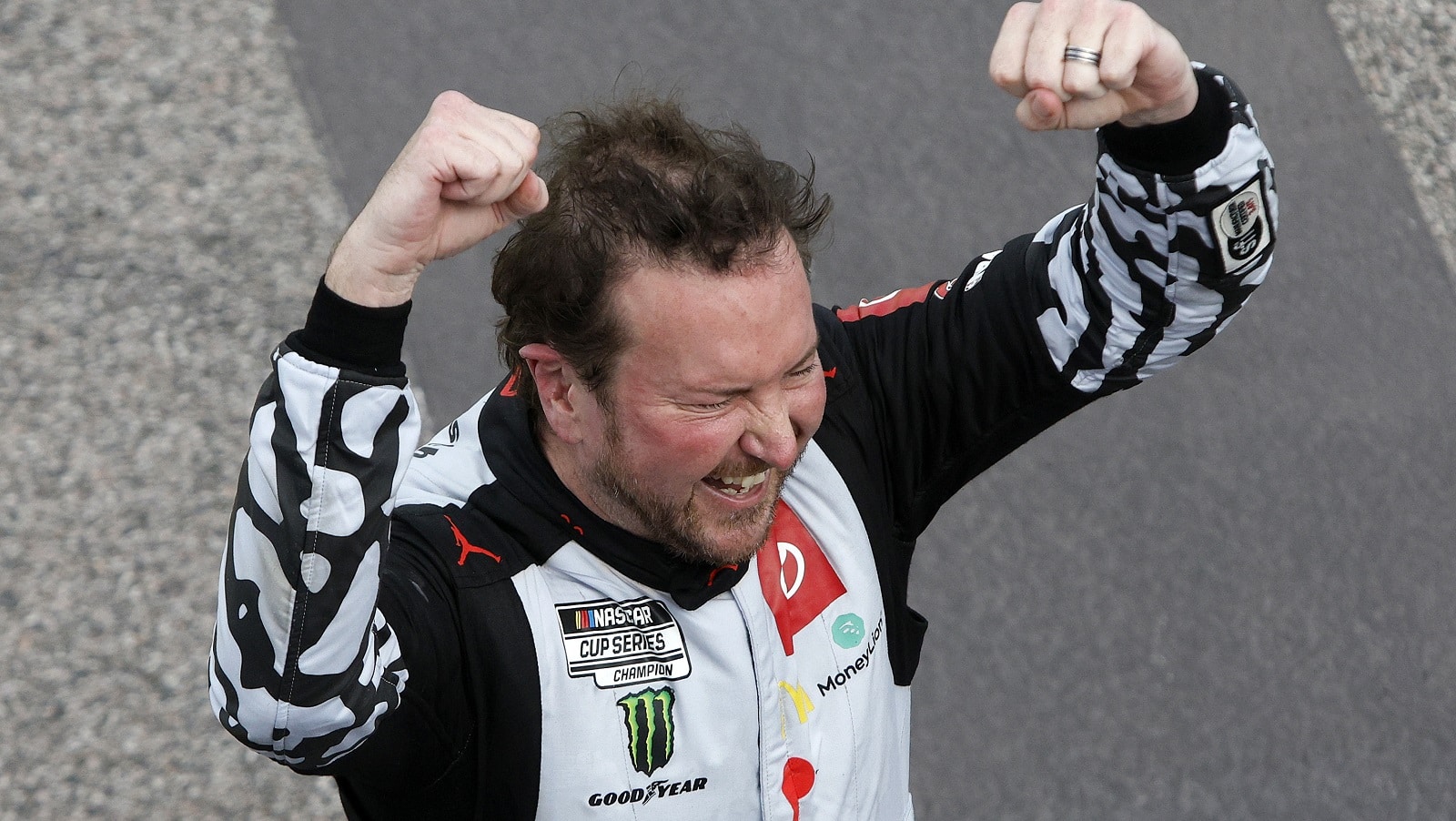 Kurt Busch celebrates after winning the NASCAR Cup Series AdventHealth 400 at Kansas Speedway on May 15, 2022.