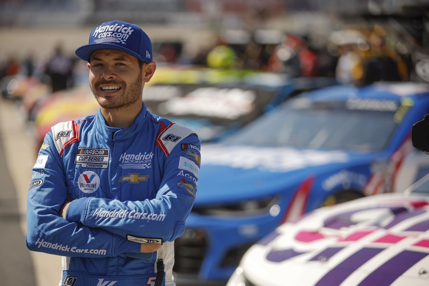 Kyle Larson looks on during practice for the DuraMAX Drydene 400 at Dover Motor Speedway on April 30, 2022.