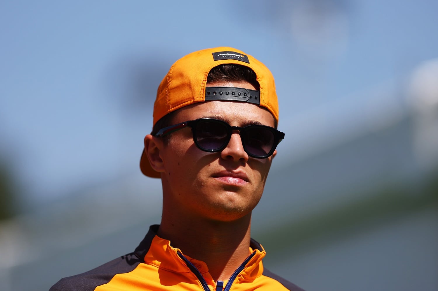 Lando Norris of Great Britain and McLaren walks in the paddock prior to practice ahead of the Formula 1 Grand Prix of Spain at Circuit de Barcelona-Catalunya on May 21, 2022 in Barcelona, Spain.