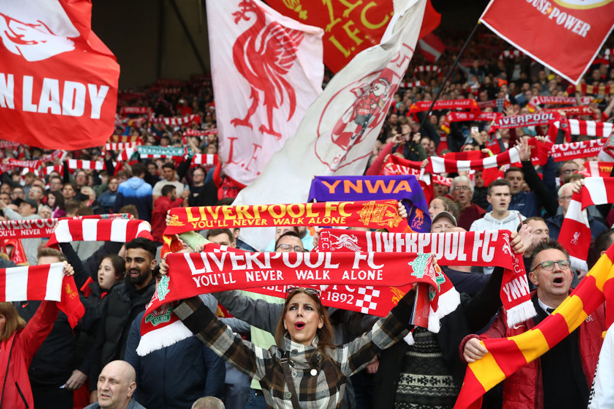 Liverpool supporters sing on the Kop.