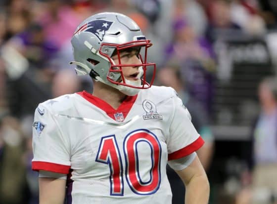 Mac Jones of the New England Patriots and AFC looks on during the 2022 NFL Pro Bowl.
