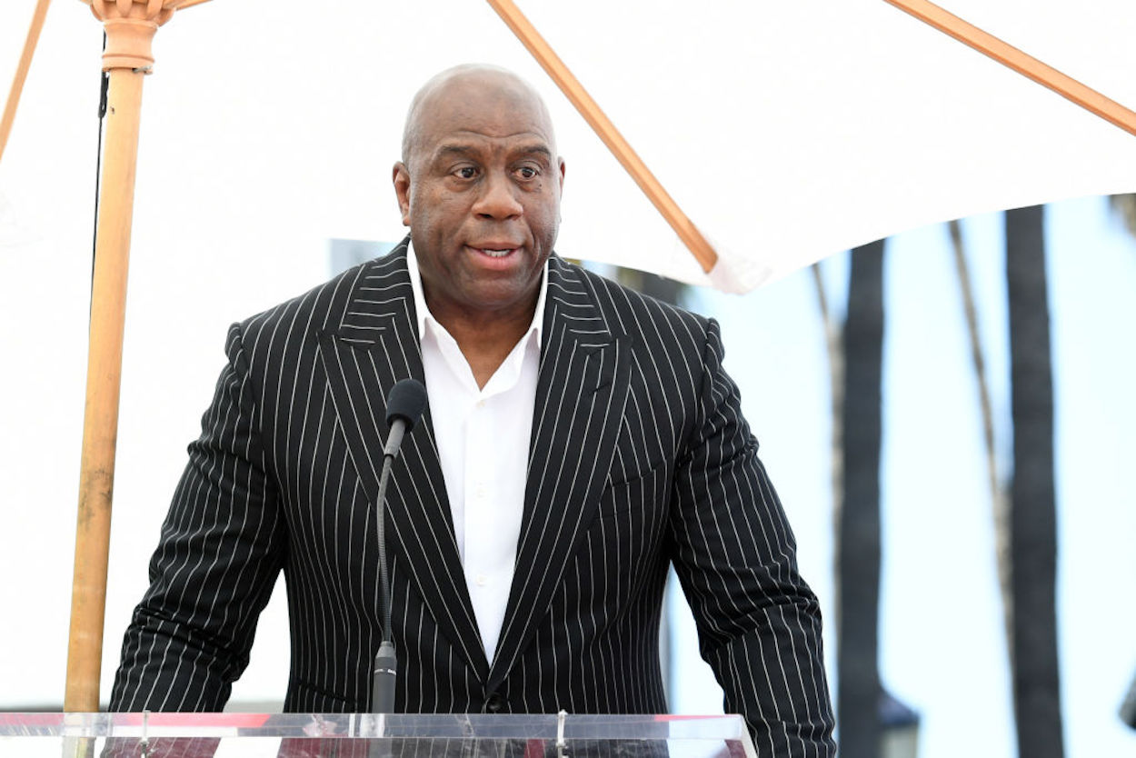 Los Angeles Lakers legend Magic Johnson speaks from a podium.
