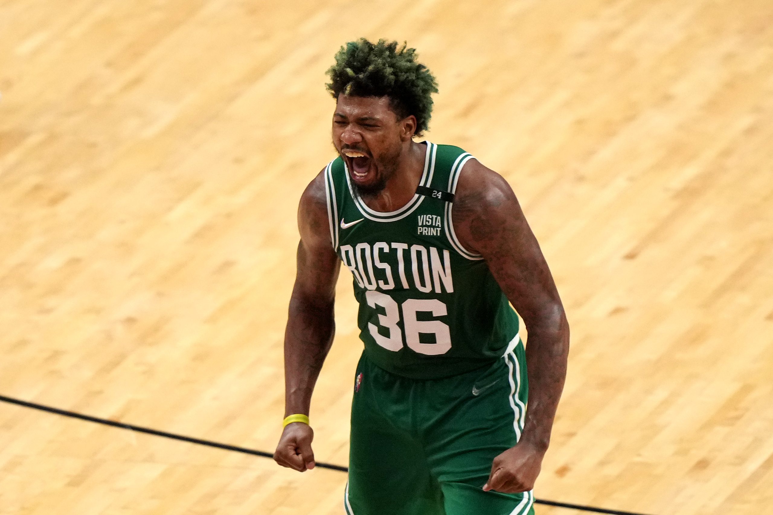 Marcus Smart of the Boston Celtics reacts after a three-point basket.