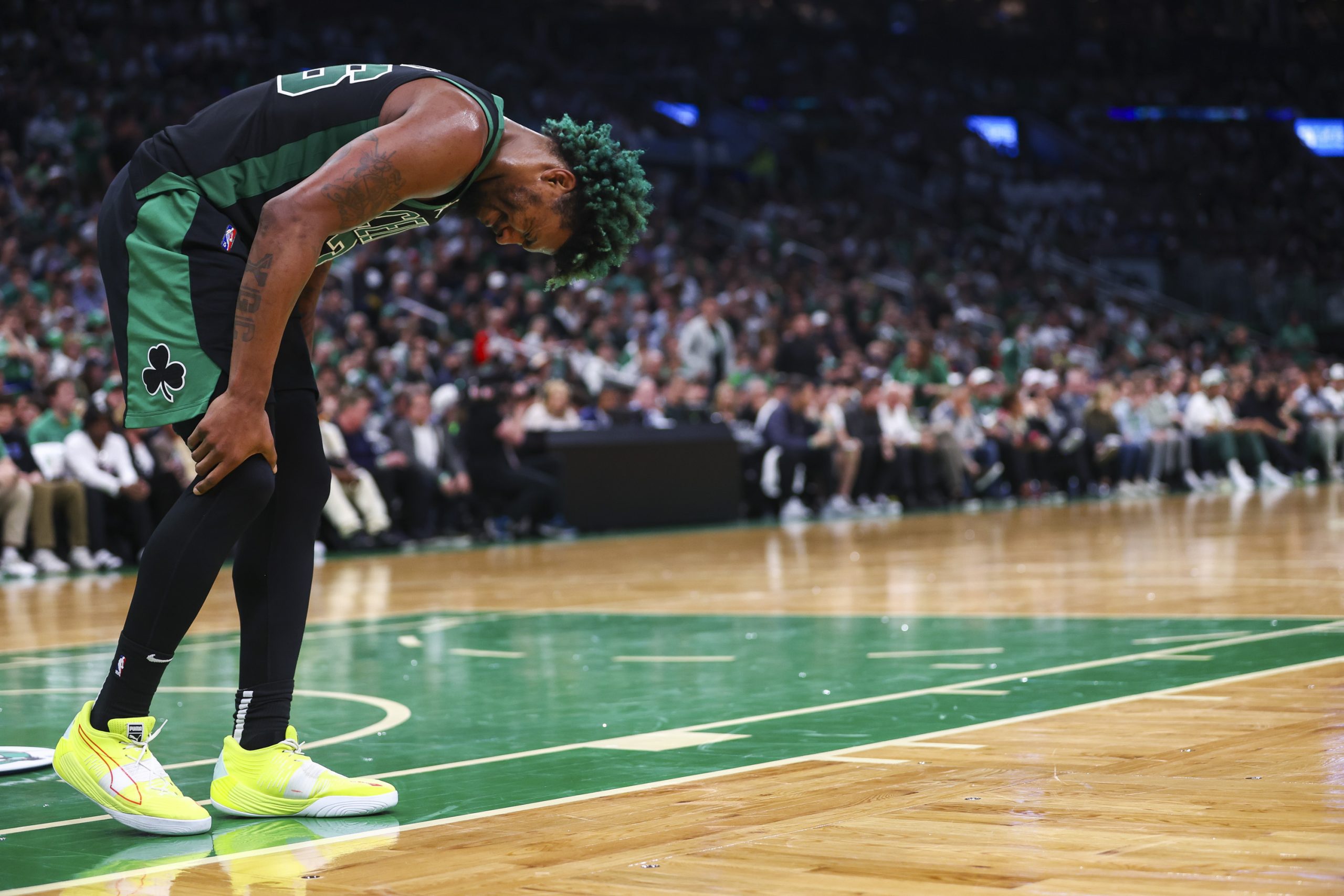 Marcus Smart of the Boston Celtics reacts after hurting his leg during Game 1 of the Eastern Conference Semifinals against the Milwaukee Bucks.