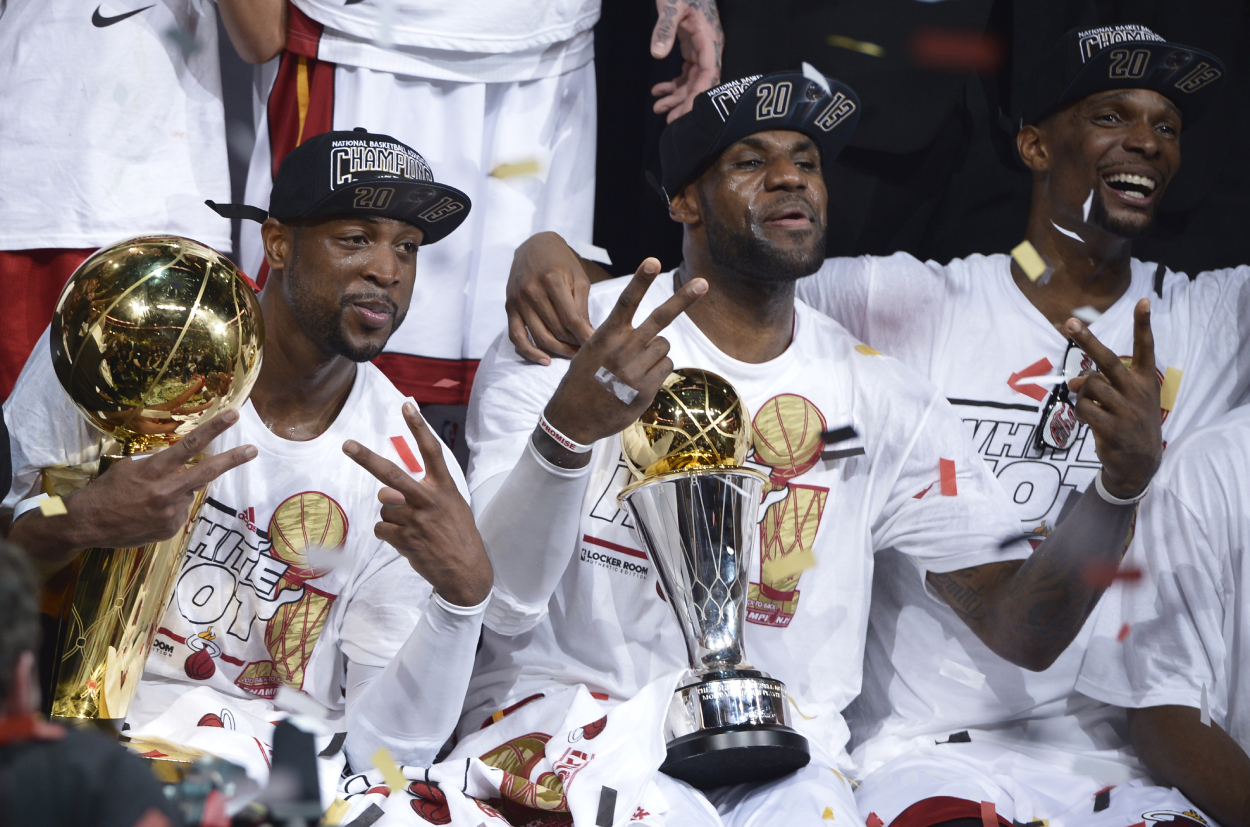 Dwyane Wade, LeBron James, and Chris Bosh after winning their 2013 NBA championship with the Miami Heat.