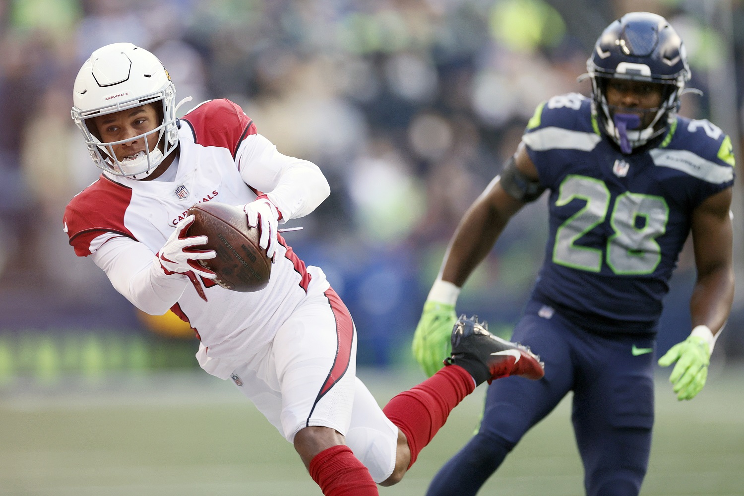 Rondale Moore of the Arizona Cardinals carries the ball against Ugo Amadi of the Seattle Seahawks during a Nov. 21, , 2021, NFL game. |  Steph Chambers/Getty Images
