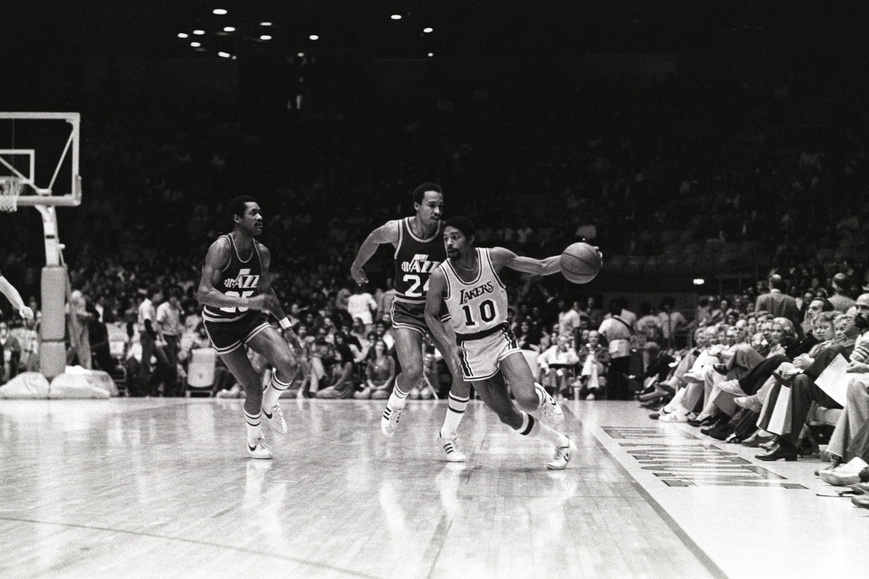 Guard Norm Nixon of the Los Angeles Lakers dribbles the ball.