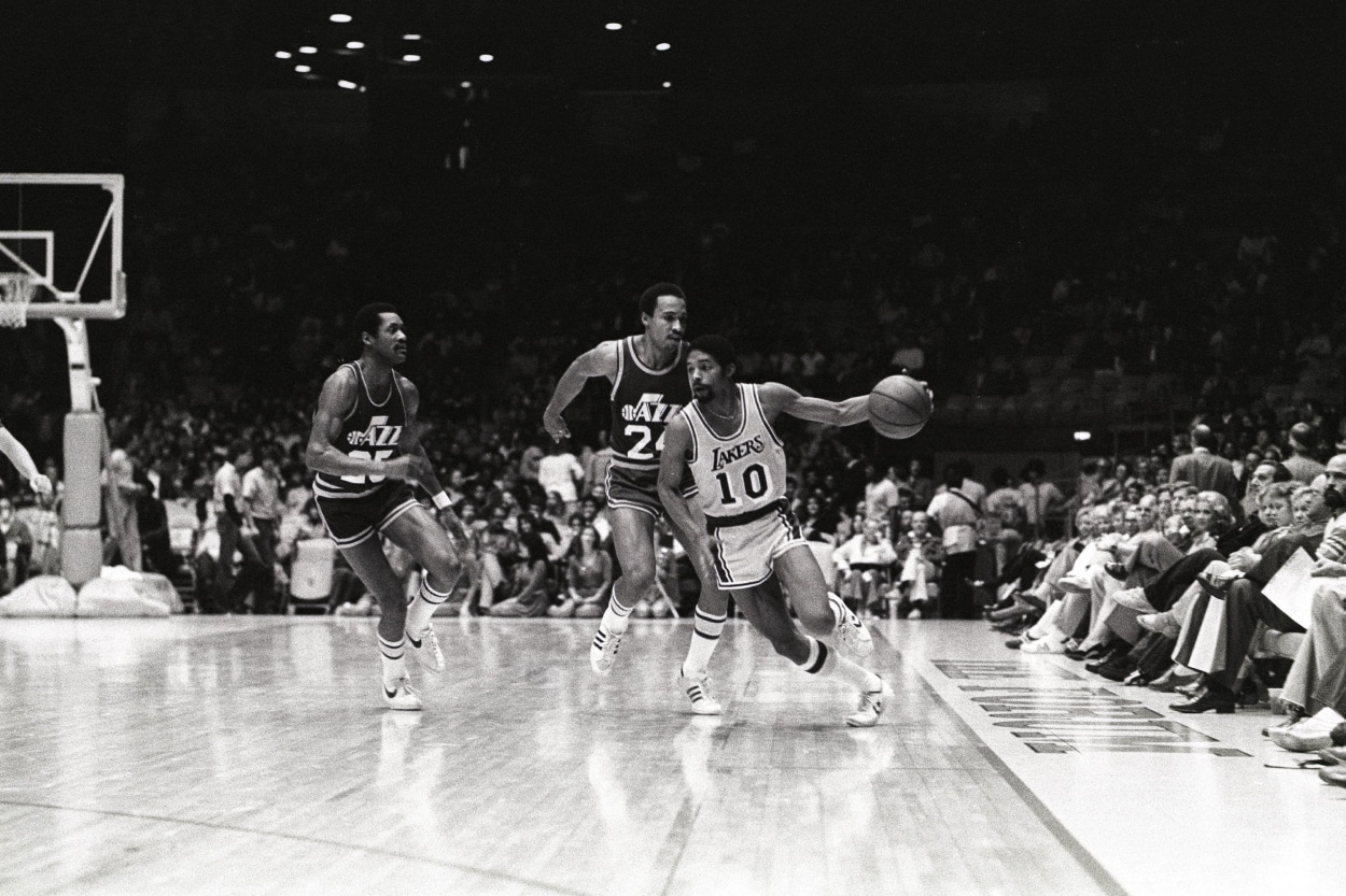 Guard Norm Nixon of the Los Angeles Lakers dribbles the ball.