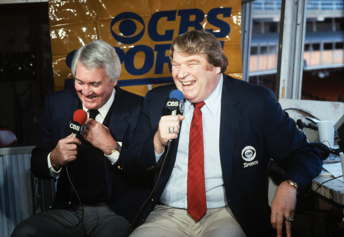 Pat Summerall and John Madden laugh during a broadcast
