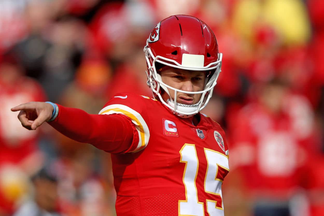 Kansas City Chiefs quarterback Patrick Mahomes points on the field.