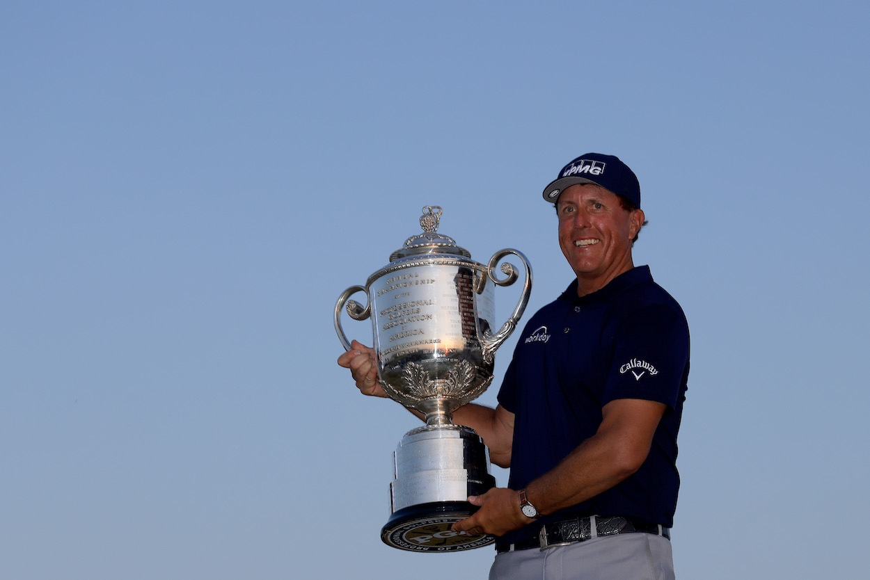Phil Mickelson poses with the Wanamaker Trophy.