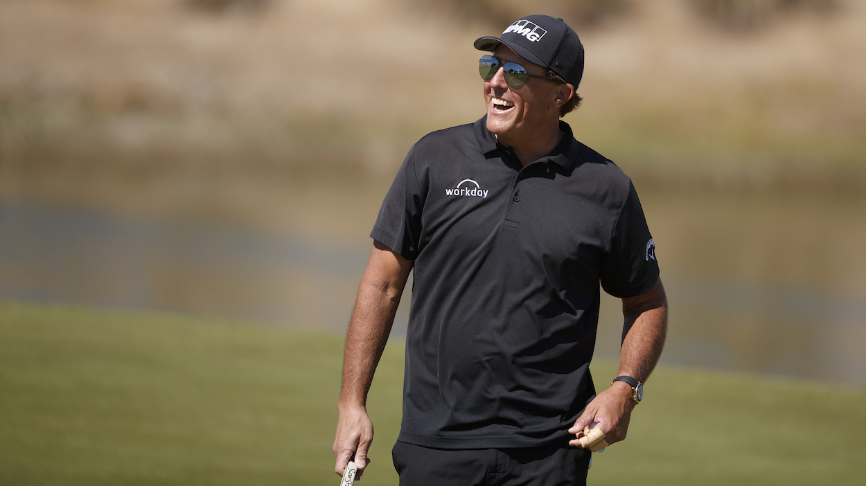 Phil Mickelson laughs during a practice round.