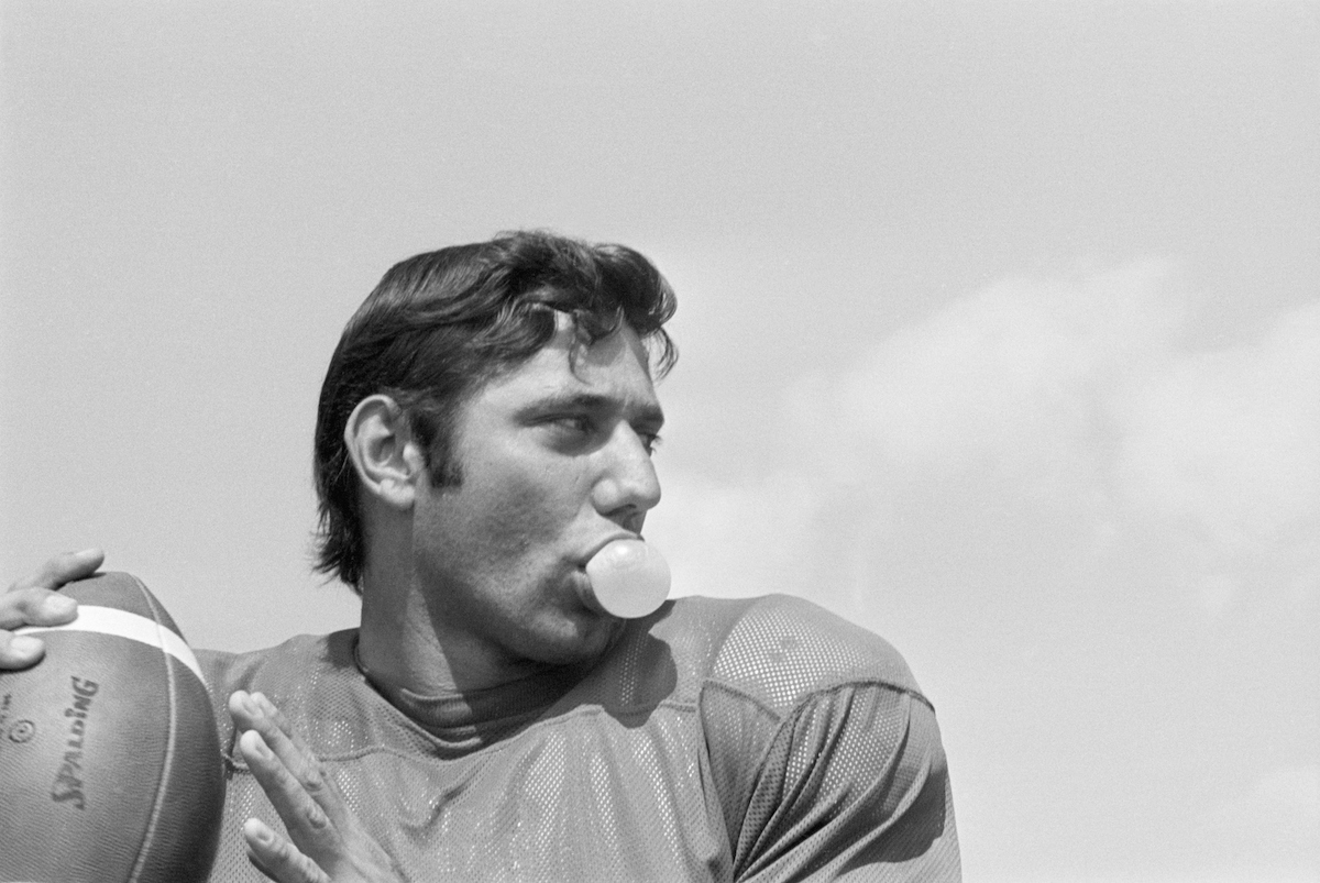 New York Jets quarterback Joe Namath chews bubble gum during passing practice at the Jets' training camp at Hofstra University