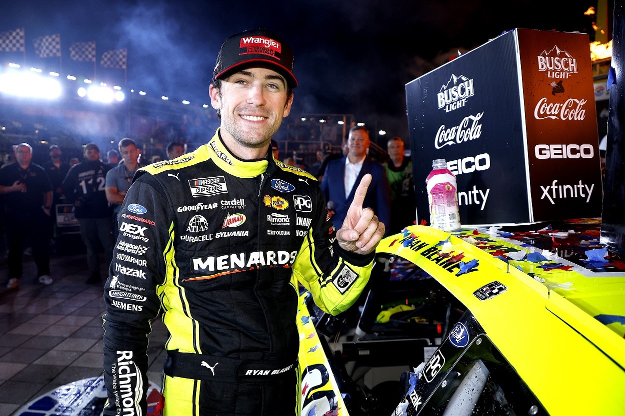 Team Penske driver Ryan Blaney after applying the winner's sticker in victory lane after winning the NASCAR Cup Series All-Star Race at Texas Motor Speedway on May 22, 2022 | Chris Graythen/Getty Images