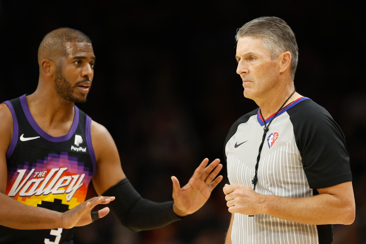 Referee Scott Foster listens to Chris Paul of the Phoenix Suns.