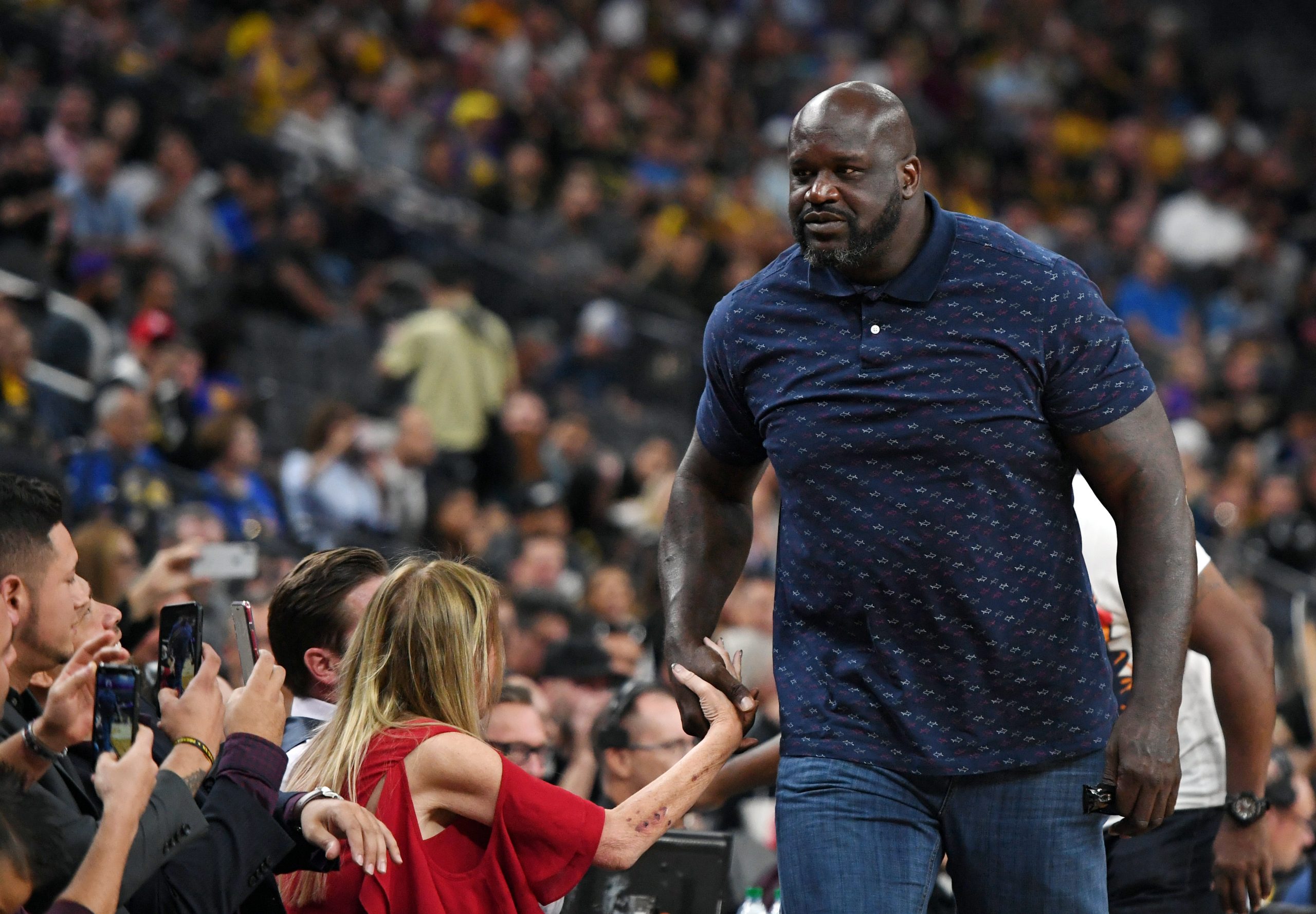 NBA analyst Shaquille O'Neal arrives at a preseason game between the Golden State Warriors and the Los Angeles Lakers.