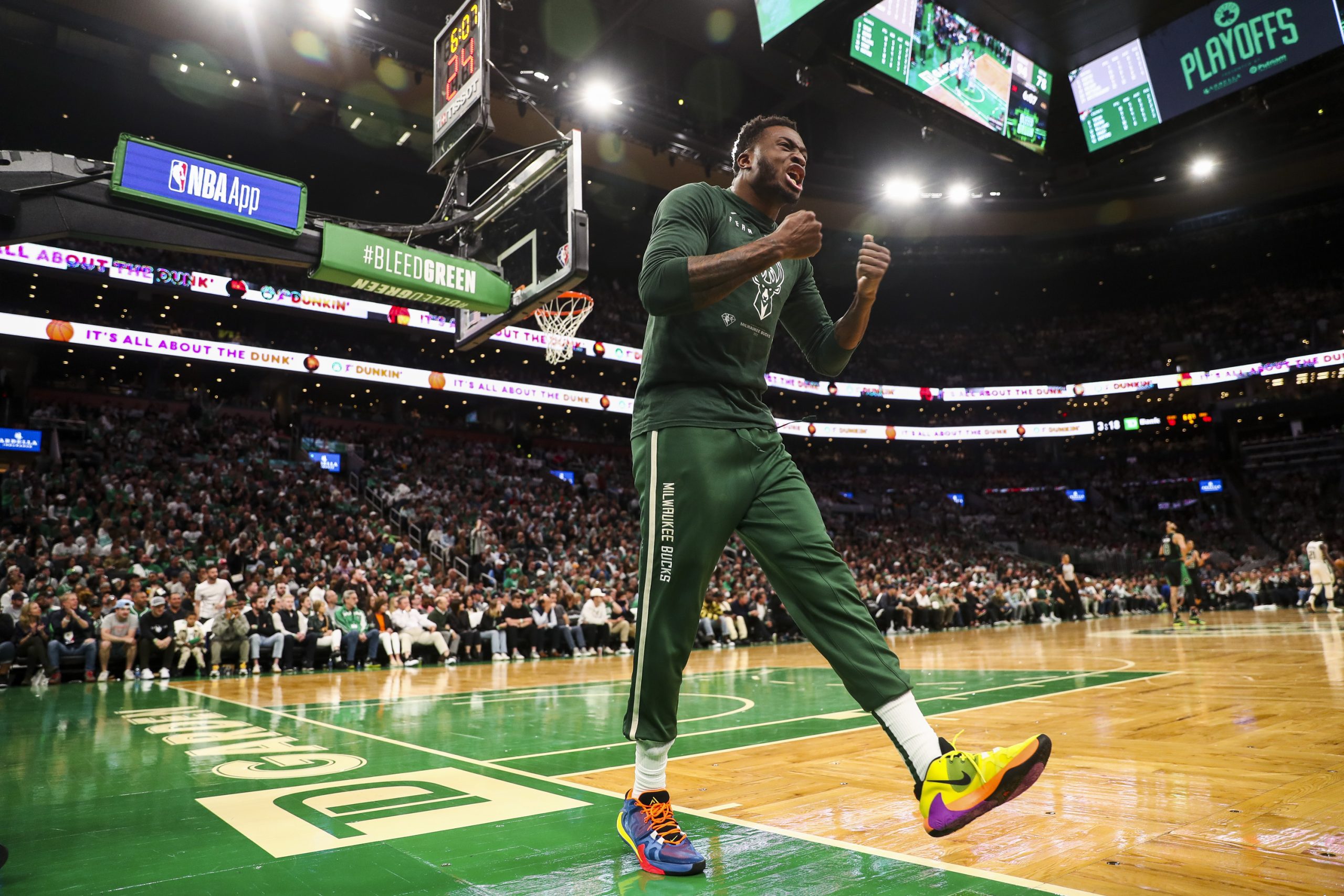 Thanasis Antetokounmpo of the Milwaukee Bucks reacts after his brother Giannis Antetokounmpo dunks.