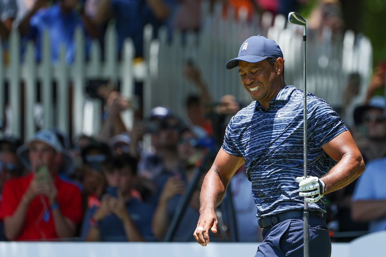 Tiger Woods winces after a shot during the PGA Championship.