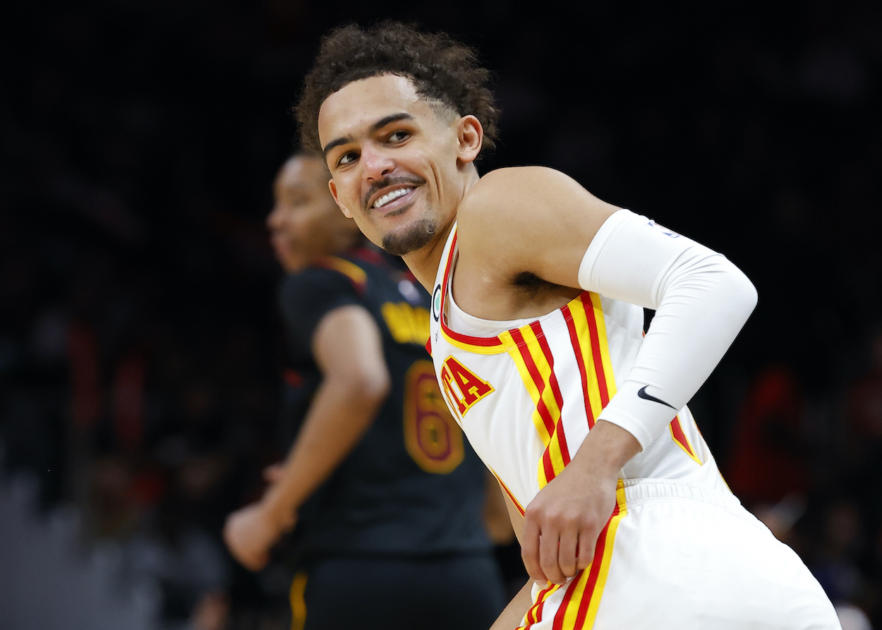 Trae Young smiles during a game against the Cavaliers.