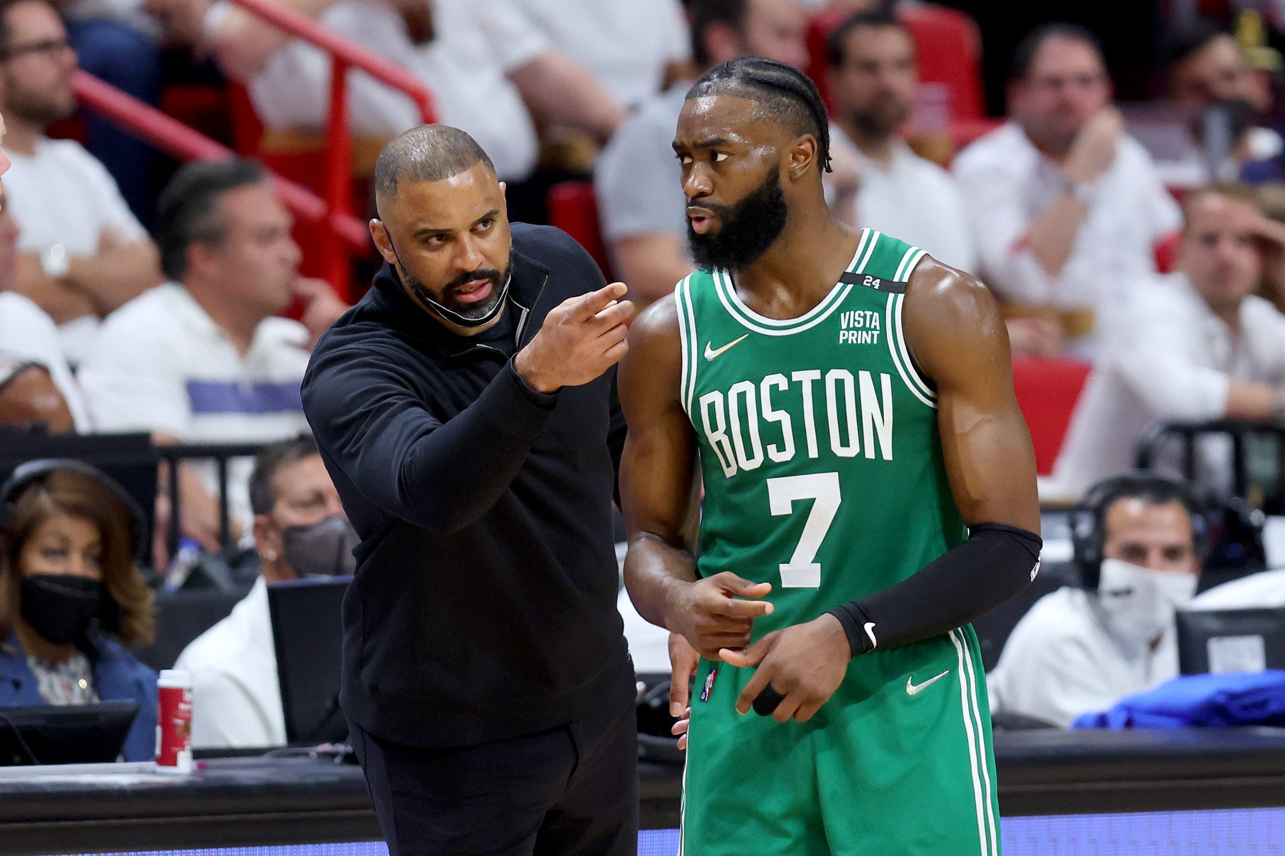 Head coach Ime Udoka of the Boston Celtics talks with Jaylen Brown.