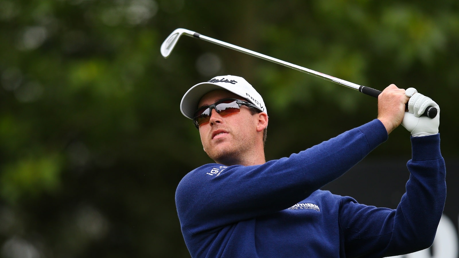 Andy Ogletree tees off on the 14th hole during Day 1 of the LIV Golf Invitational at The Centurion Club on June 9, 2022, in St Albans, England.