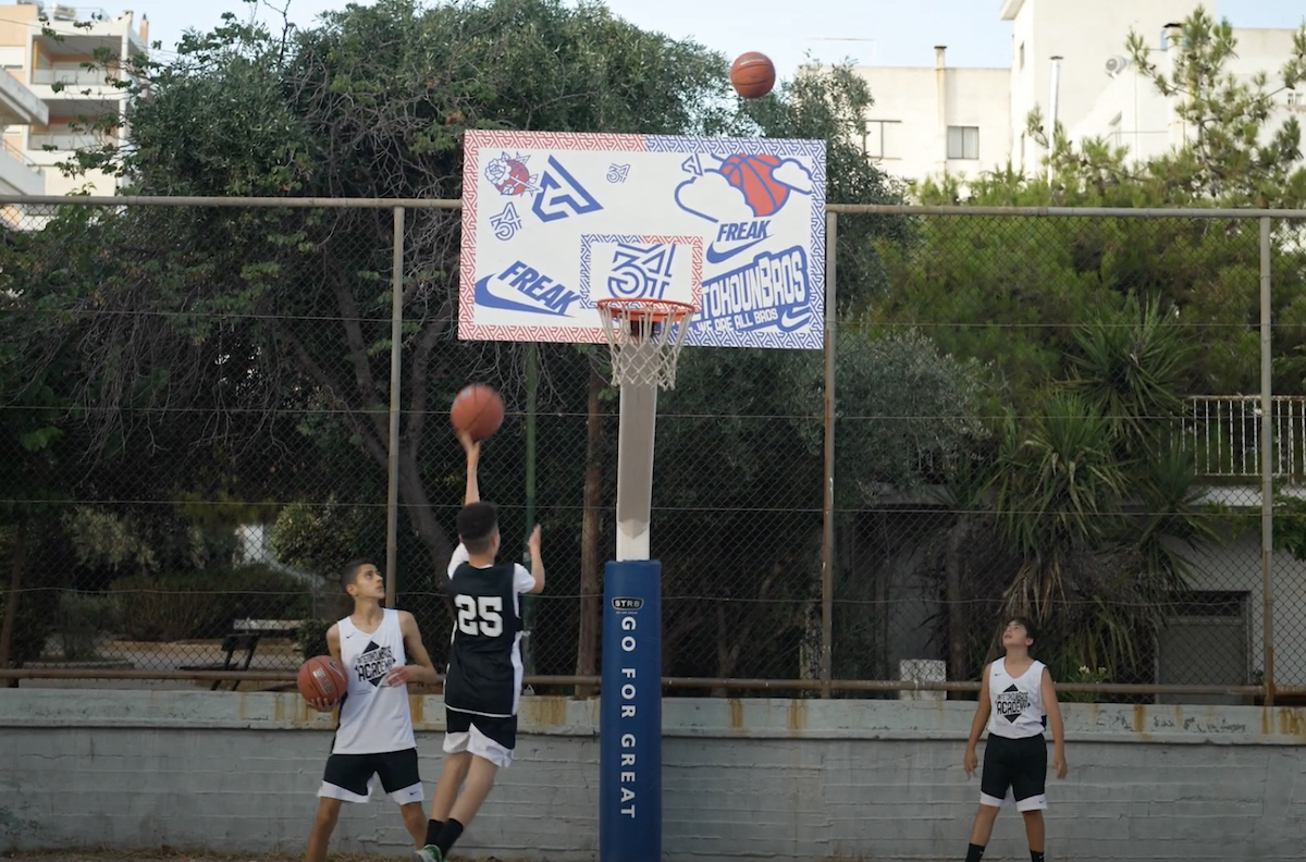Young athletes play basketball at Giannis Antetokounmpo's AntetokounΒros Academy