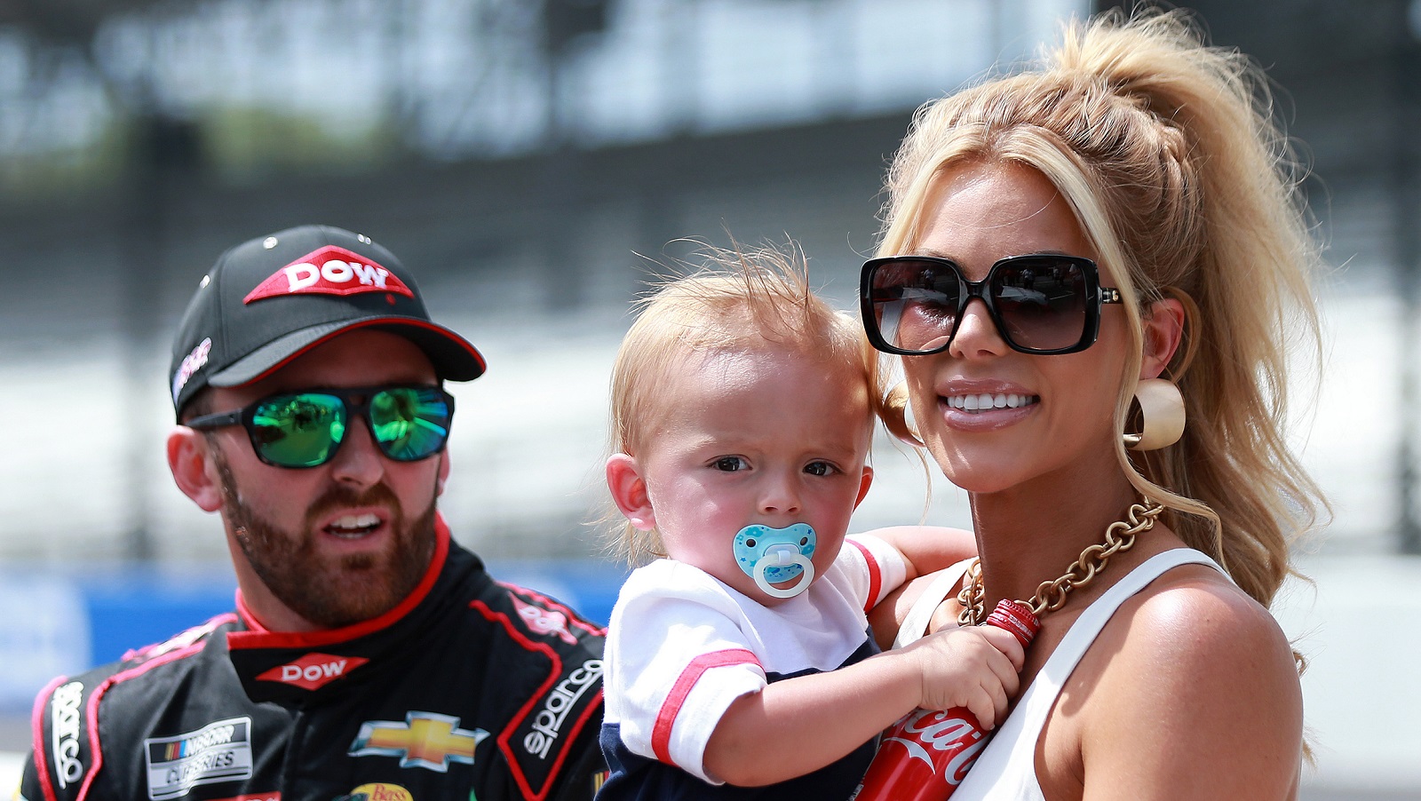 Austin Dillon spends time with wife Whitney Ward and on Ace on on the grid prior to the NASCAR Cup Series Verizon 200 at the Brickyard at Indianapolis Motor Speedway on Aug. 15, 2021.
