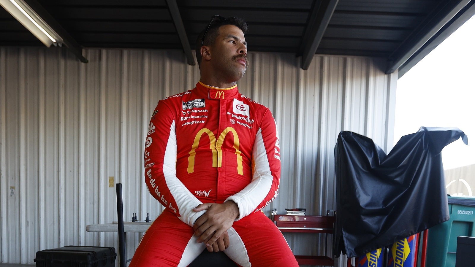 Bubba Wallace waits in the garage area during practice for the NASCAR Cup Series Enjoy Illinois 300 at WWT Raceway on June 3, 2022.