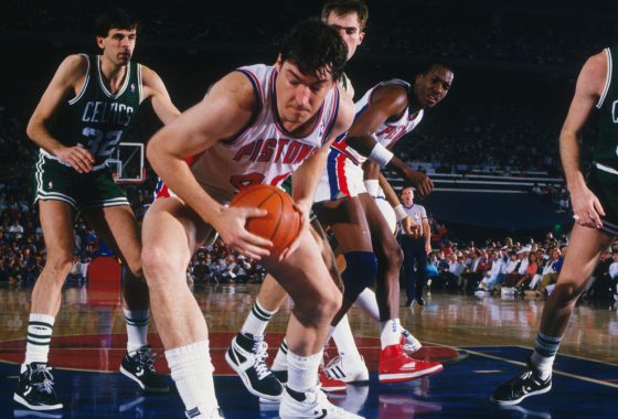 Detroit Pistons center Bill Laimbeer takes the ball during the NBA playoffs against the Boston Celtics.