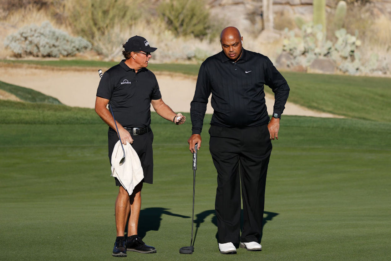 Charles Barkley (R) and Phil Mickelson (L) on the golf course.