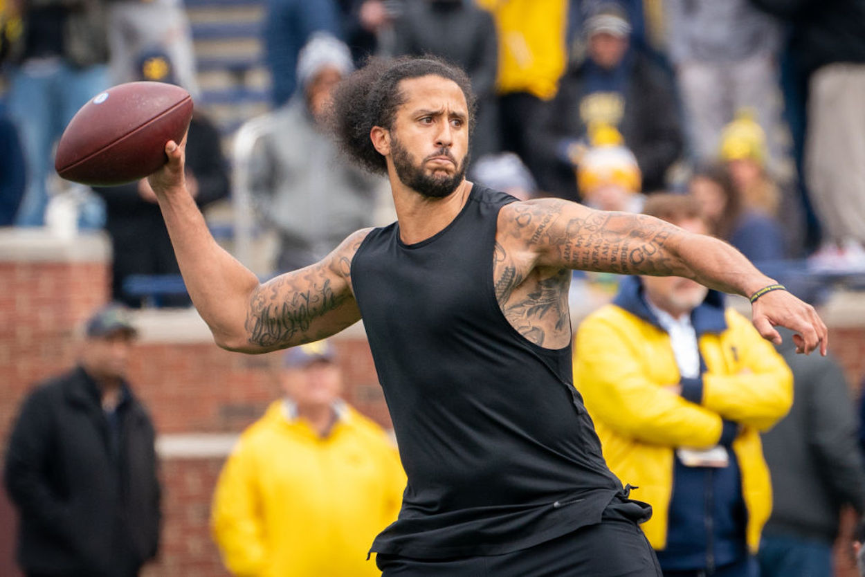 Colin Kaepernick throws a pass in spring 2022.