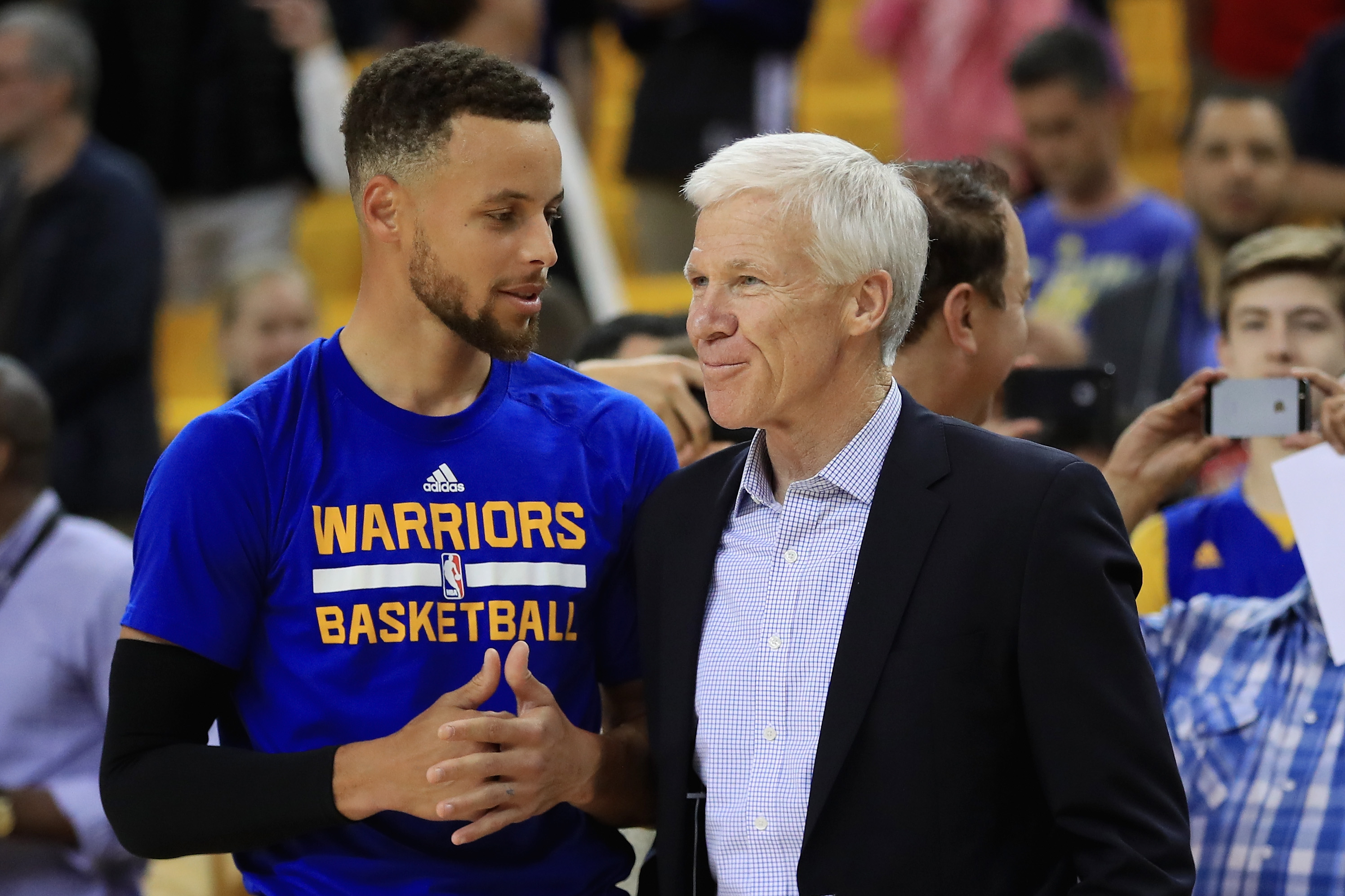 Stephen Curry of the Golden State Warriors speaks with Davidson head coach Bob McKillop prior to Game 1 of the 2017 NBA Finals.