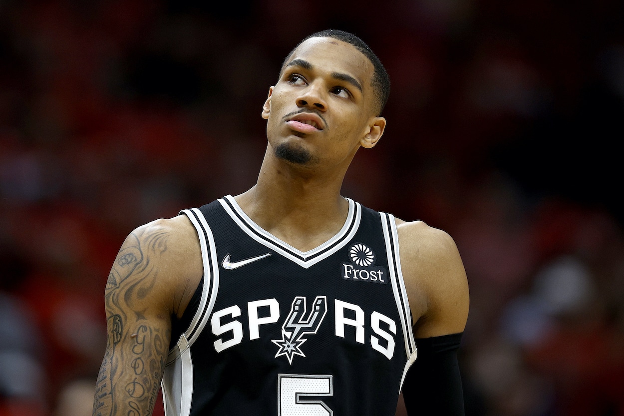 Dejounte Murray looks on during a game.