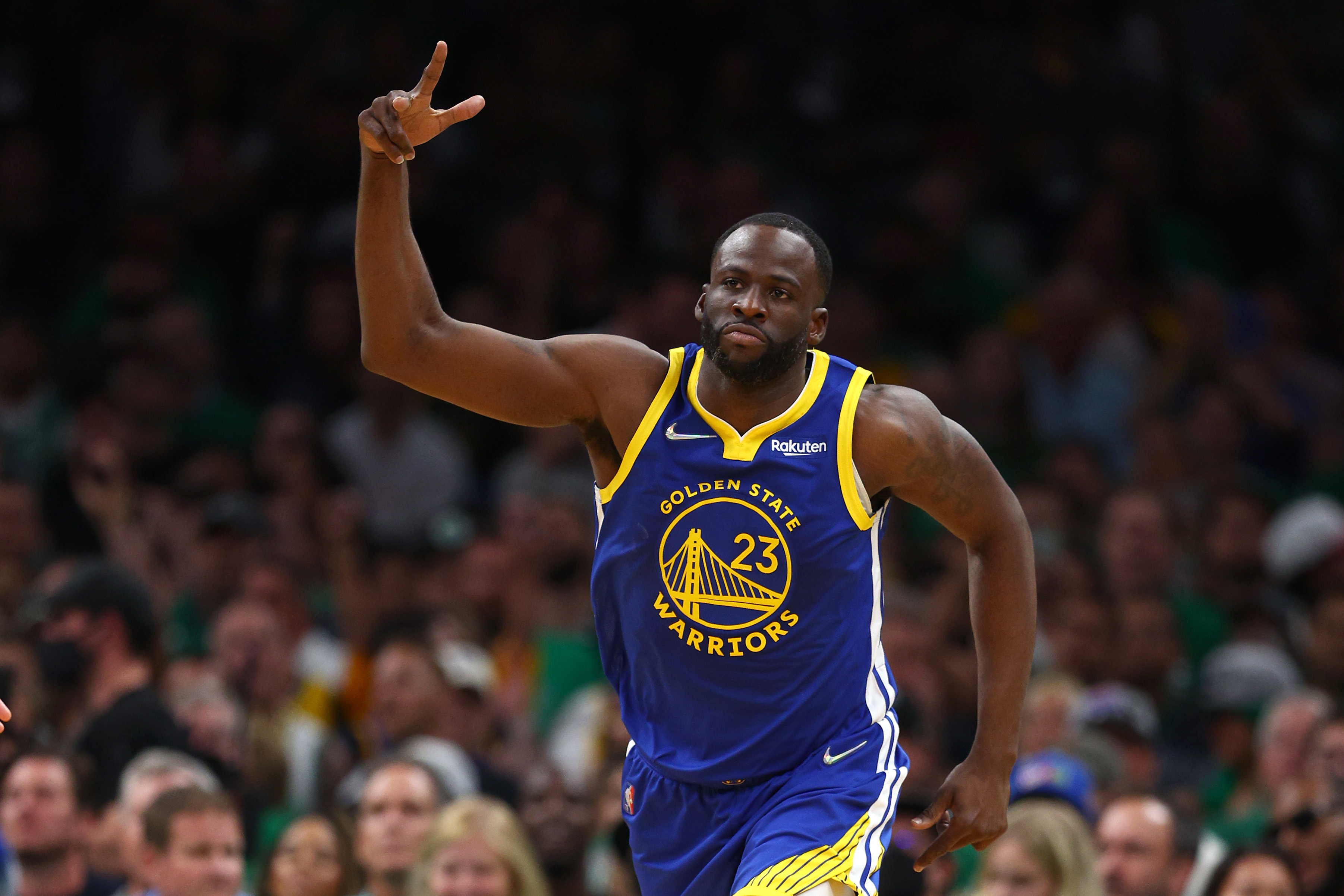Draymond Green of the Golden State Warriors celebrates a three-pointer against the Boston Celtics.