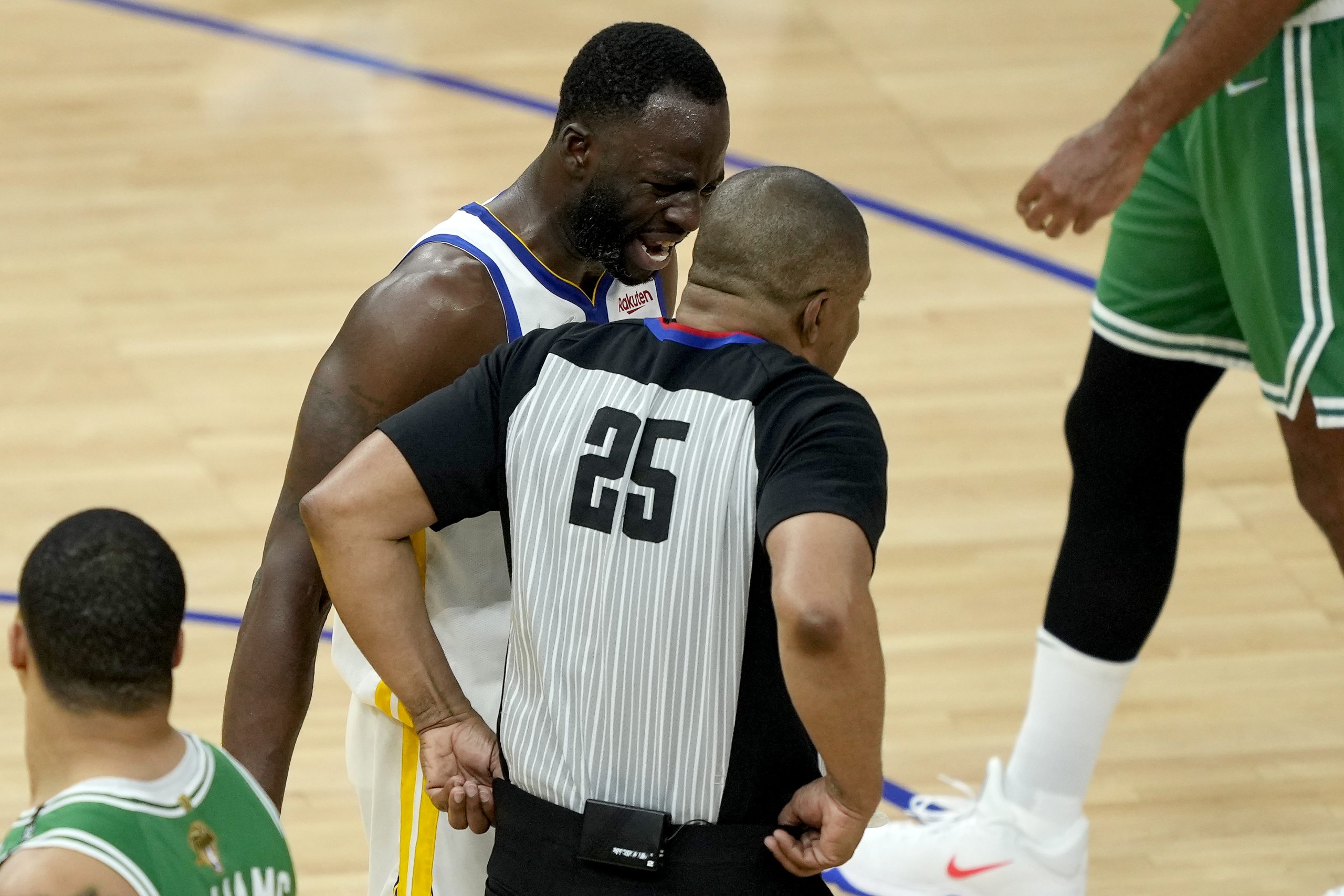 Draymond Green of the Golden State Warriors talks to referee Tony Brothers.