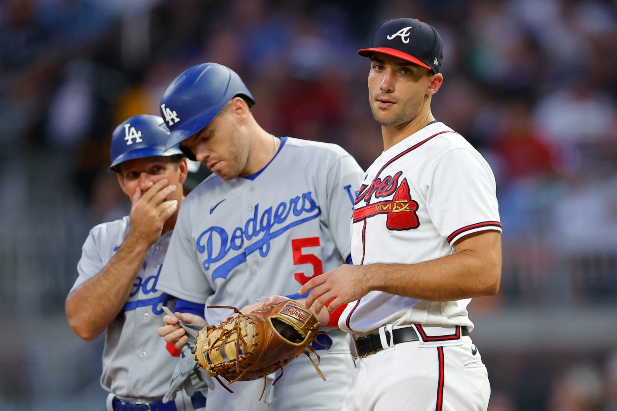 Freddie Freeman #5 of the Los Angeles Dodgers stands at first alongside Matt Olson #28 of the Atlanta Braves.