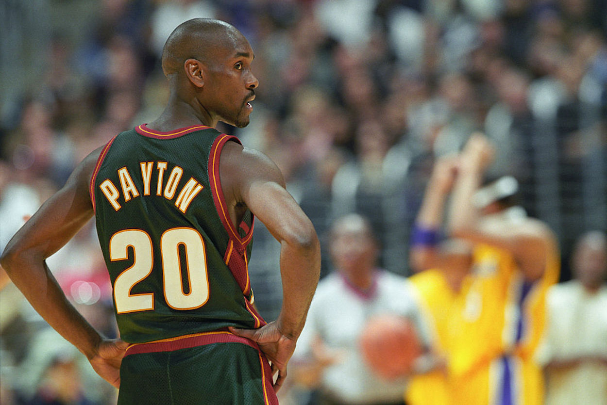 Gary Payton looks over his shoulder during an NBA game.