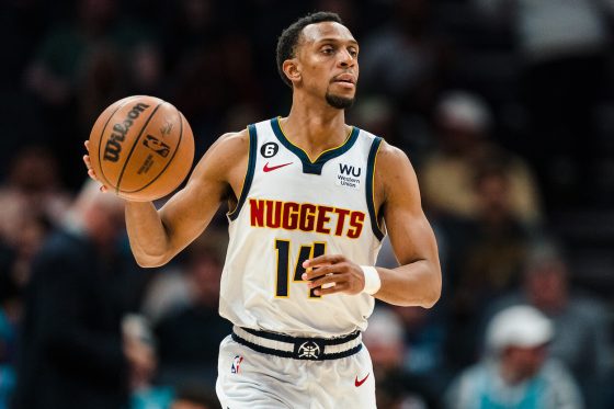 Ish Smith dribbles the ball against the Hornets.