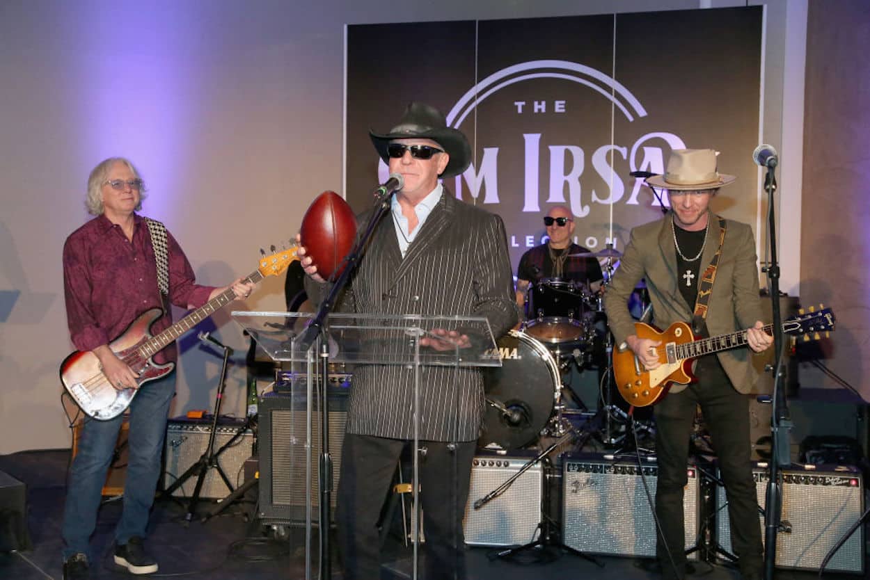 Indianapolis Colts owner Jim Irsay holds a football during a 2021 performance.