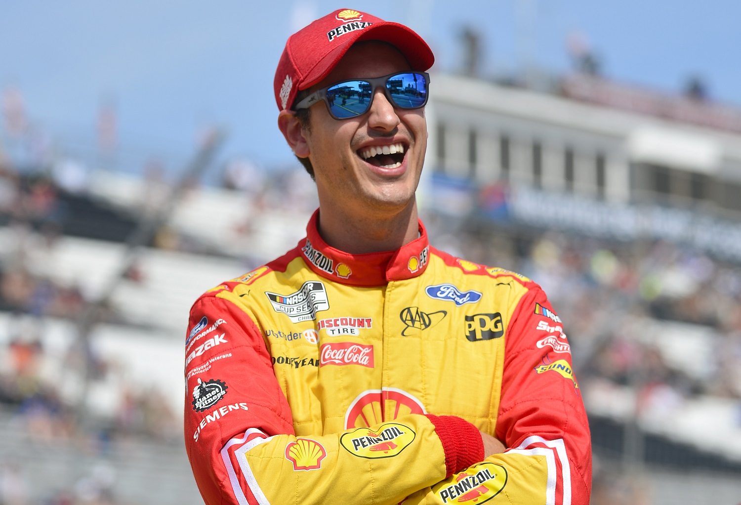 Joey Logano laughs on the grid during qualifying for the NASCAR Cup Series Enjoy Illinois 300 at WWT Raceway on June 4, 2022 in Madison, Illinois.