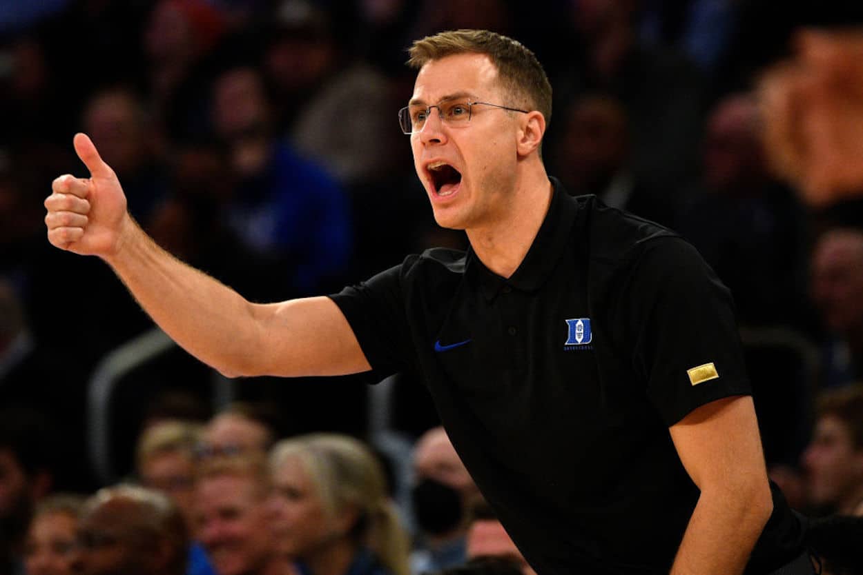 Jon Scheyer gestures to the Duke Blue Devils.