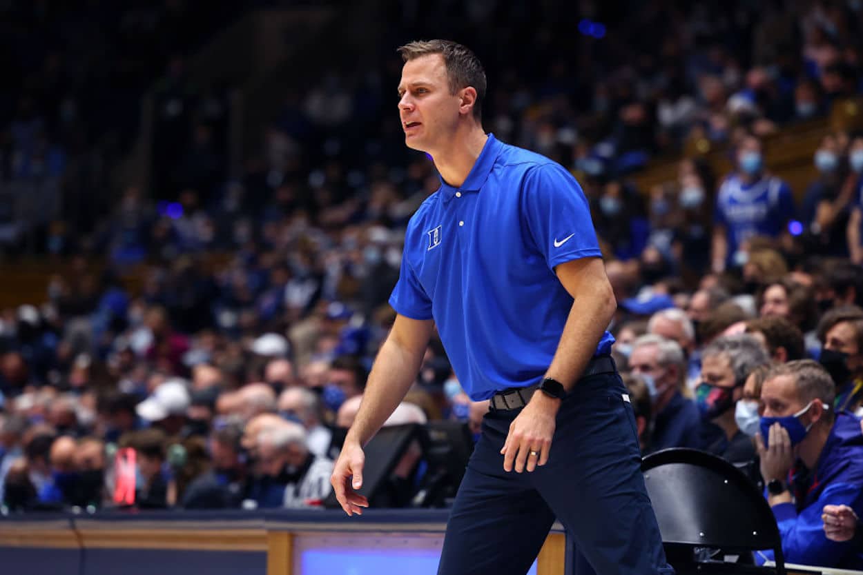 Jon Scheyer coaches the Duke Blue Devils from the sidelines.