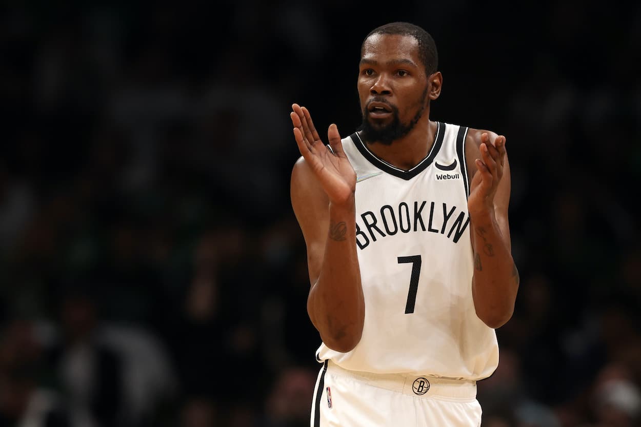 Kevin Durant claps during a game against the Celtics.