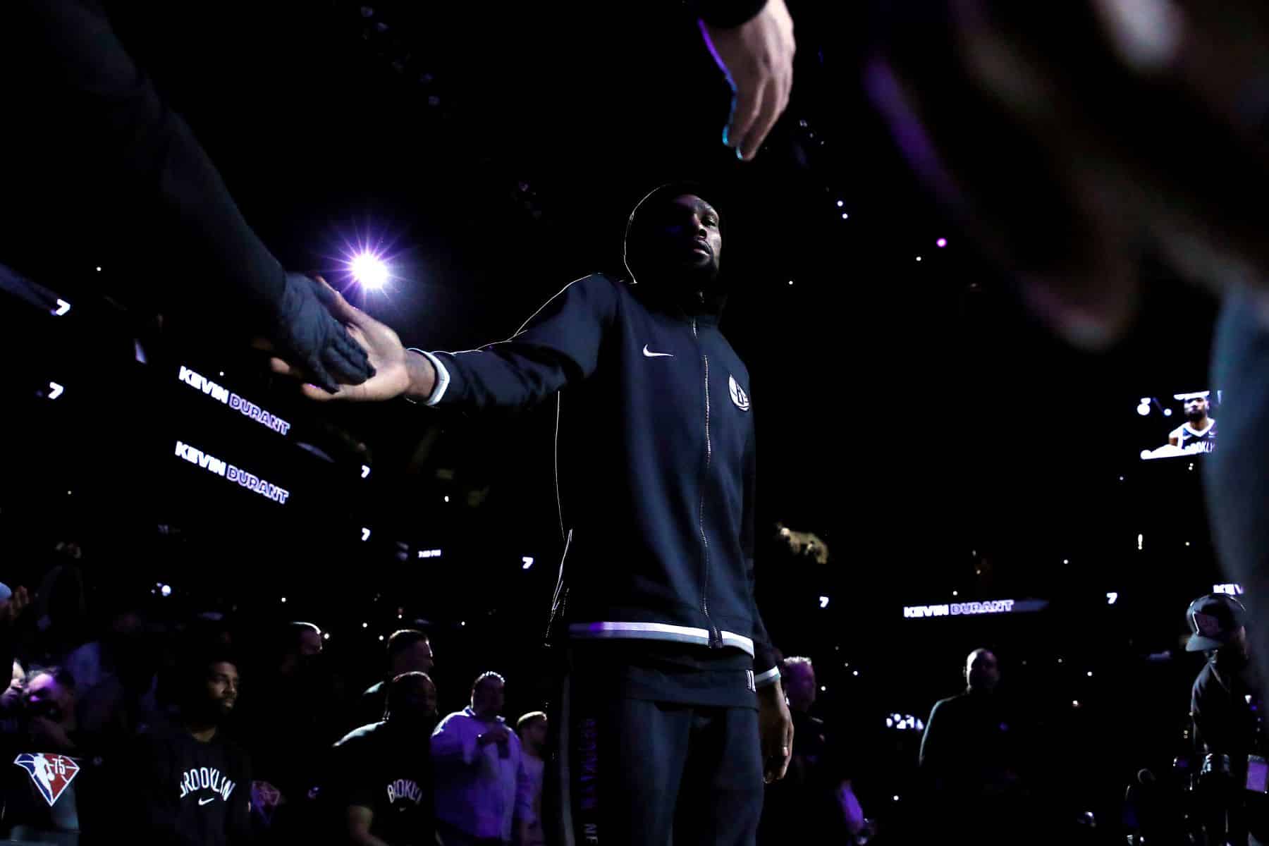 Kevin Durant high-fiving teammates before the Eastern Conference 2022 Play-In Tournament